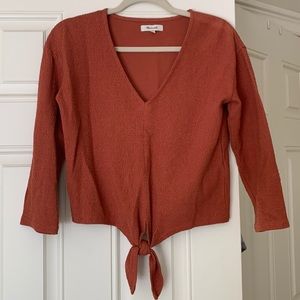 Madewell burnt orange tied, textured long sleeve blouse.